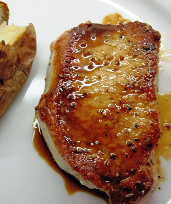 Pork chops served with pan sauce 2