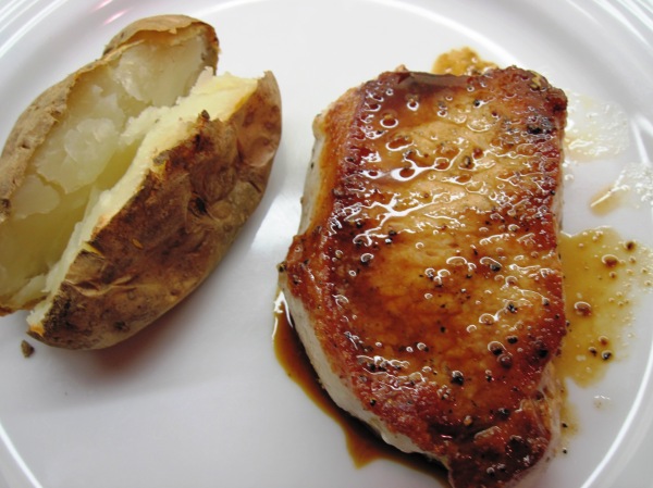Pork chops served with pan sauce