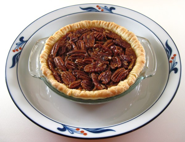 Pecan Pie sitting in a 9-inch plate
