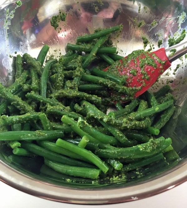 mixing-beans-with-cilantro-sauce