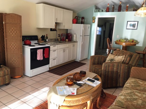 Living room and kitchenette at the Lovely Guest House
