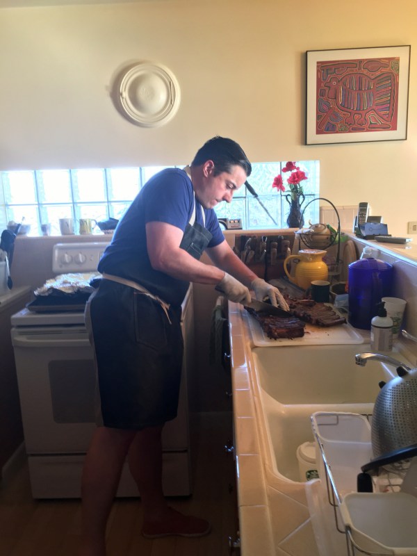 Byron cutting up his ribs