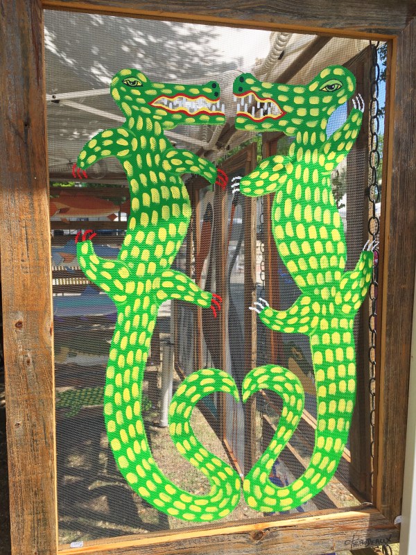 Alligators painted on a screen.jpg