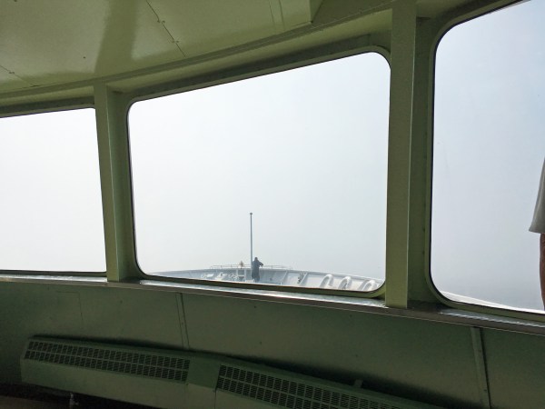 Lone crewman on watch in the fog